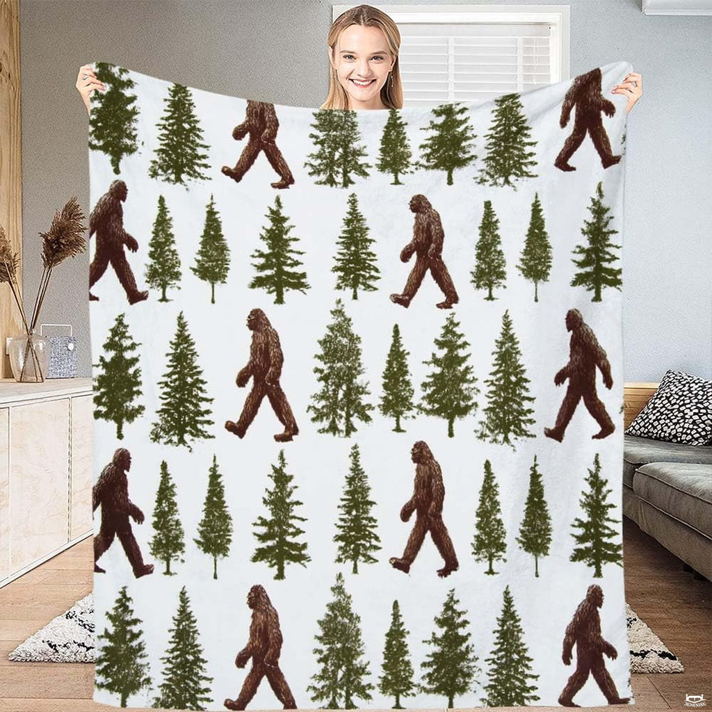 Pine forest bedding showing repeating walking Sasquatch silhouettes and evergreen trees on white.