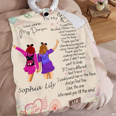 Living room sofa setting displaying the sisterhood companionship throw blanket draped over furniture.