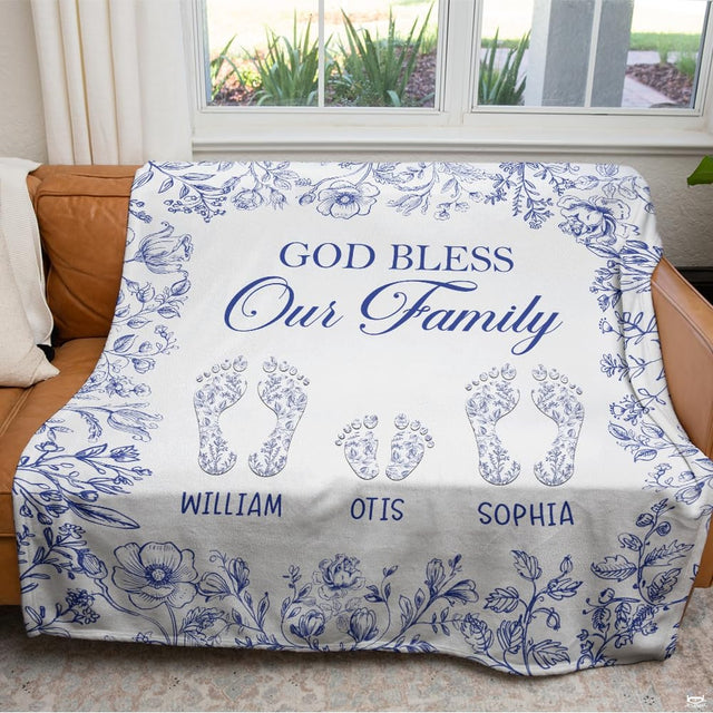 Close-up perspective of cobalt blue calligraphy and botanical floral garland on Blanket.