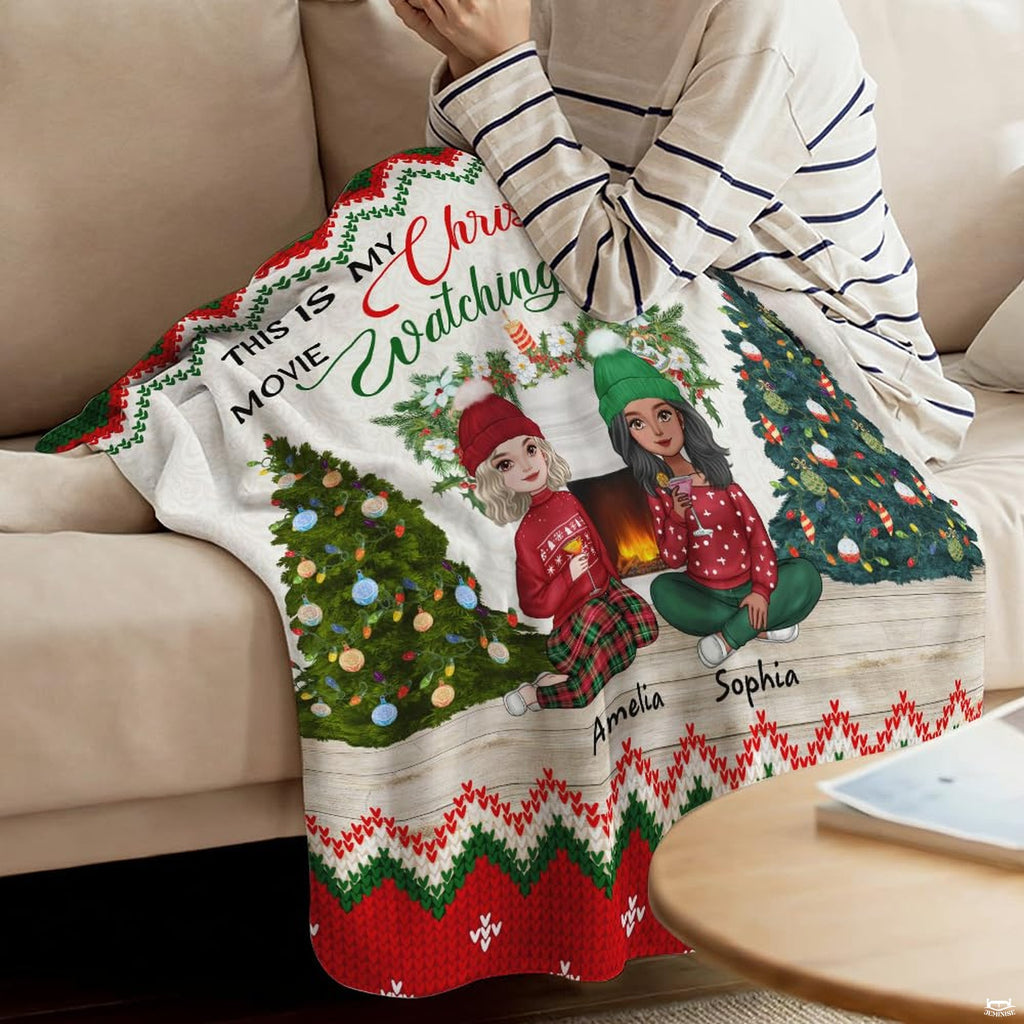 Holiday hearthside motif draped across indoor furniture in a modern living space.