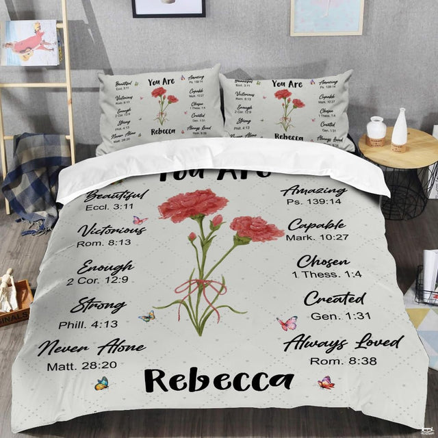 Close-up view of wildflower bedding highlighting detailed floral illustrations and faith affirmations
