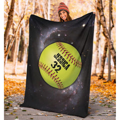 Detailed view of chartreuse athletic ball and cosmic nebula graphic print