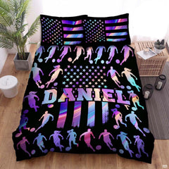 Electric violet and black soccer sports bedding featuring a soccer ball graphic with purple accents on a bed