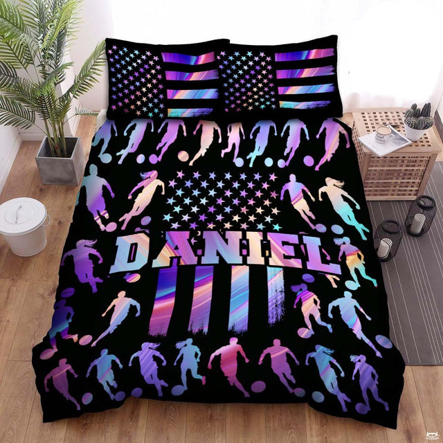 Electric violet and black soccer sports bedding featuring a soccer ball graphic with purple accents on a bed