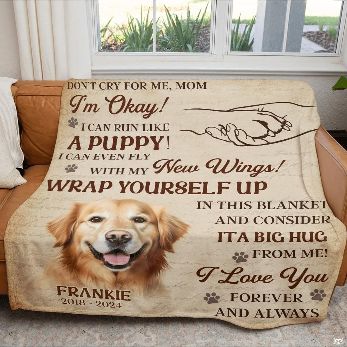 Golden retriever memorial throw blanket draped across a living room sofa