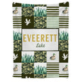 Mallard duck throw blanket featuring patchwork tiles of camouflage, pine trees, and waterfowl.
