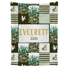 Mallard duck throw blanket featuring patchwork tiles of camouflage, pine trees, and waterfowl.