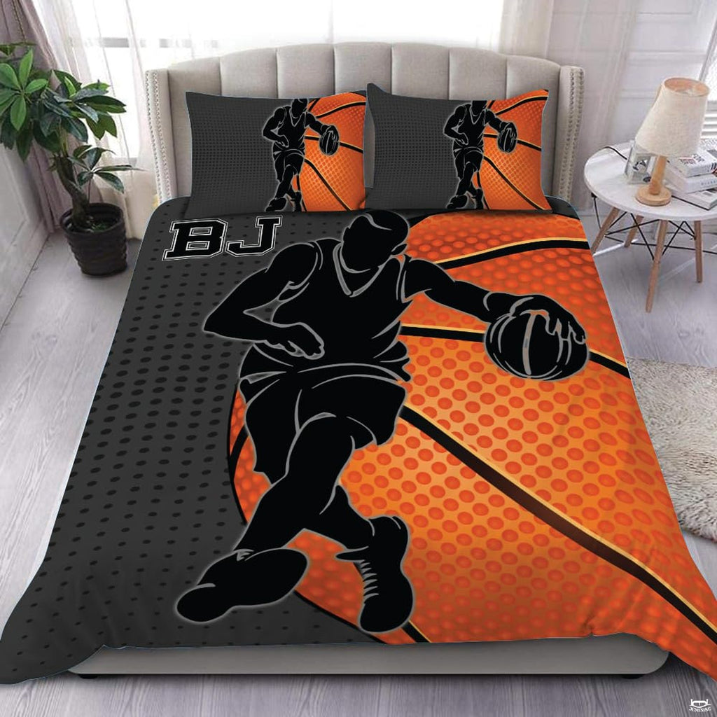 Basketball dribble player silhouette sports bedding featuring an athletic guard and orange basketball on a bed