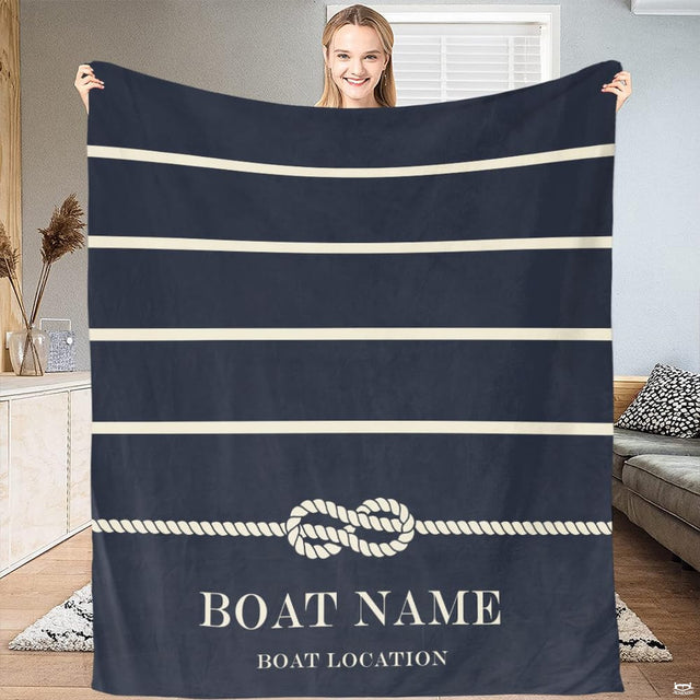 Navy nautical bedding with sailor stripes and detailed maritime rope knot artwork.