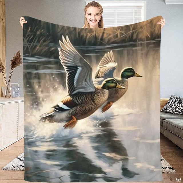 Full view of the wildlife throw blanket displaying the airborne mallard waterfowl scene