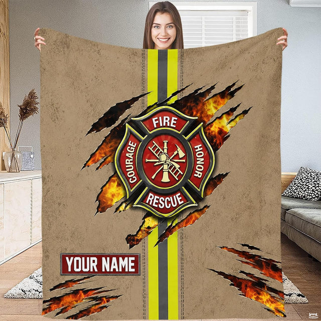 Close-up perspective of dimensional red Maltese cross emblem and firefighter tool icons on Blanket.