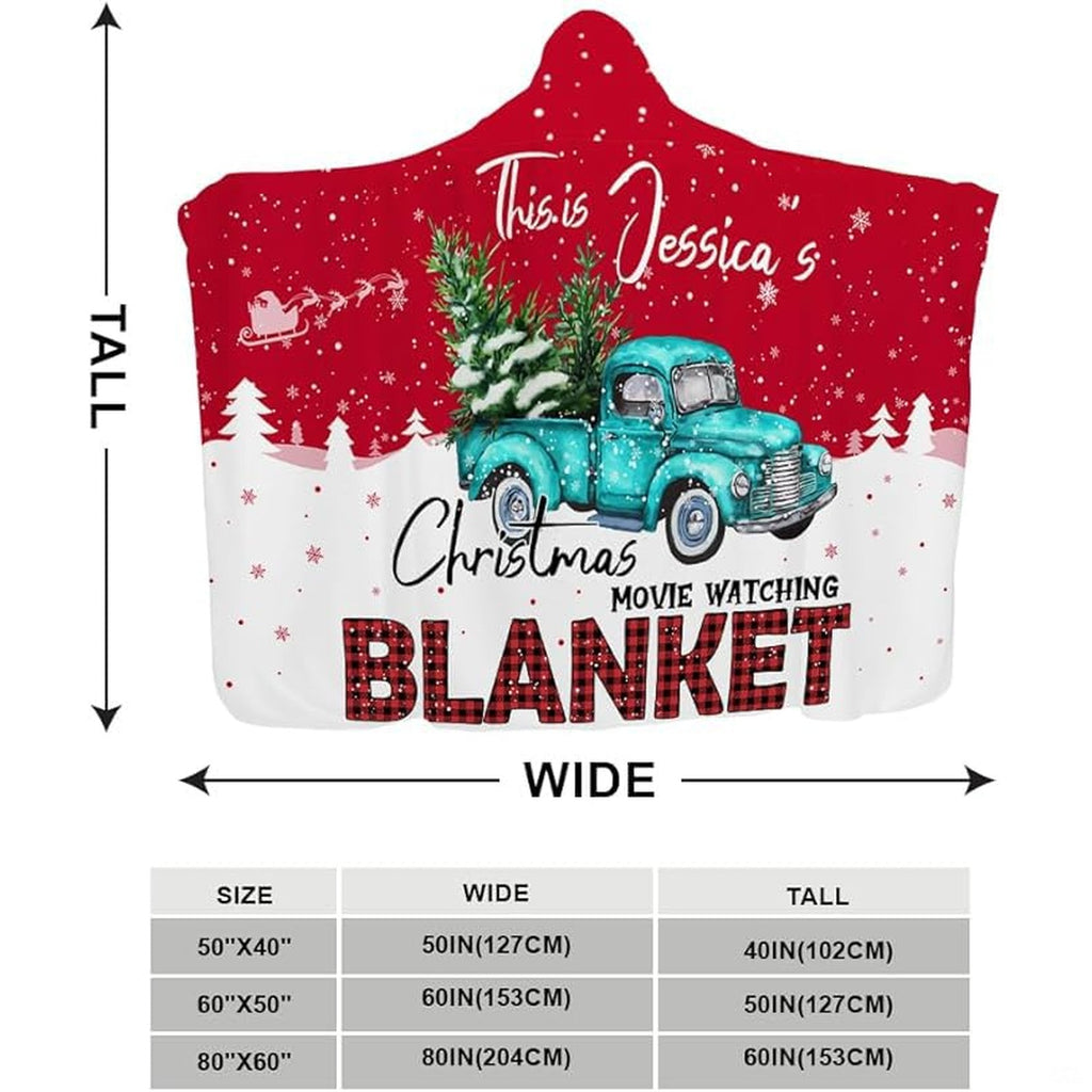 Festive turquoise pickup carrying evergreens across snowdrift bedding illustration.