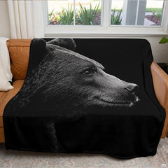 Close up of monochrome bear throw blanket highlighting silvery fur textures and detailed bear profile