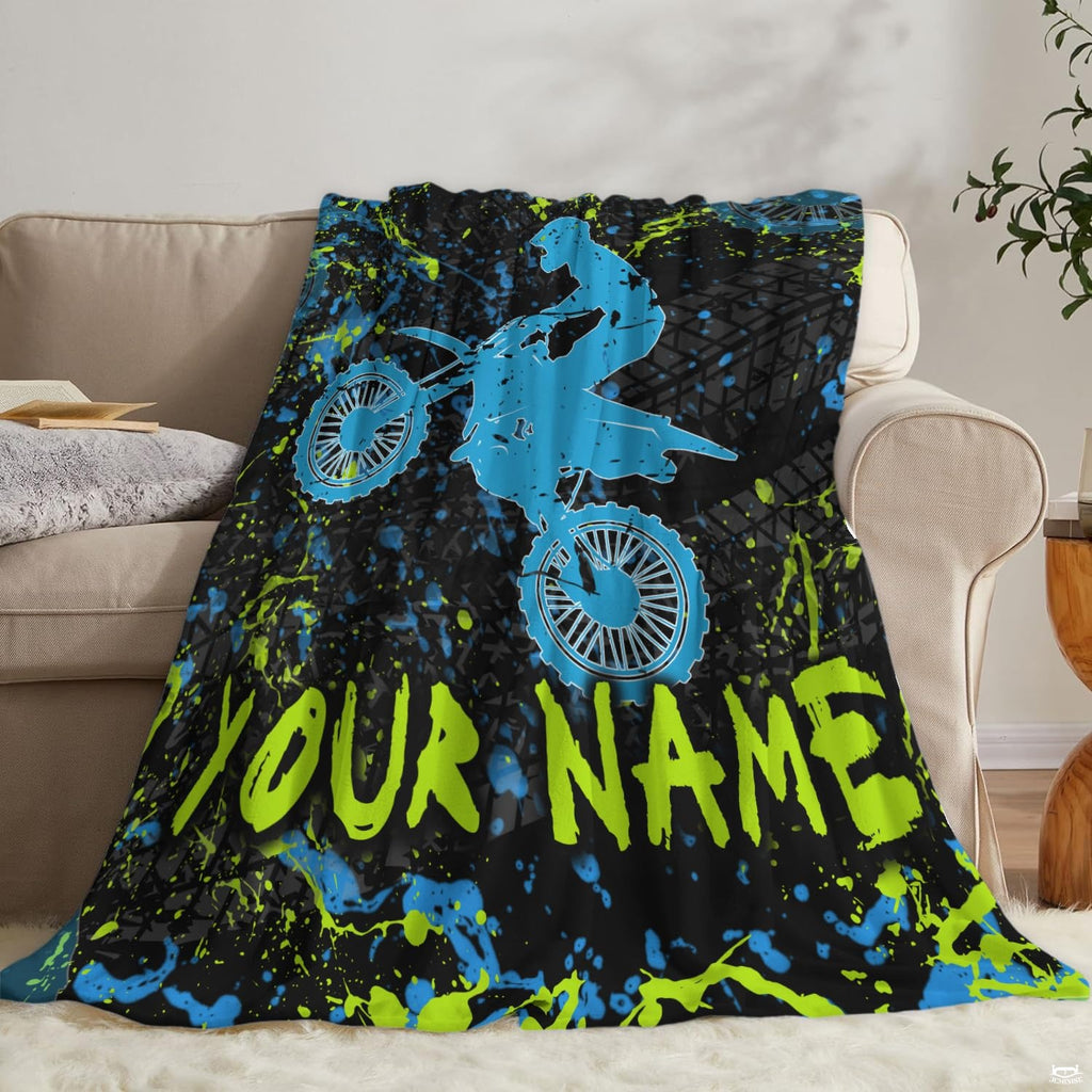 Airborne motocross dirt bike rider silhouette with neon splatters and tire tracks, view 6.