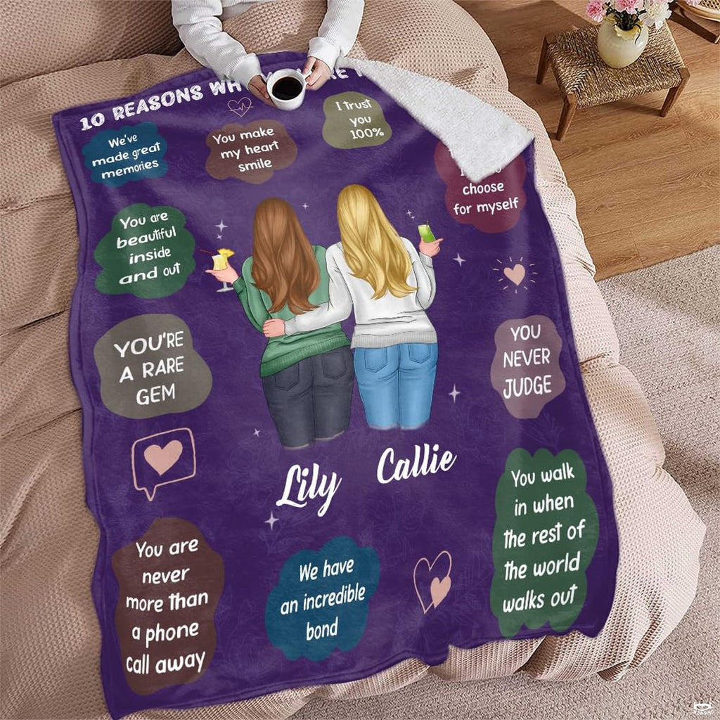 Two sisters artwork blanket folded on living room chair