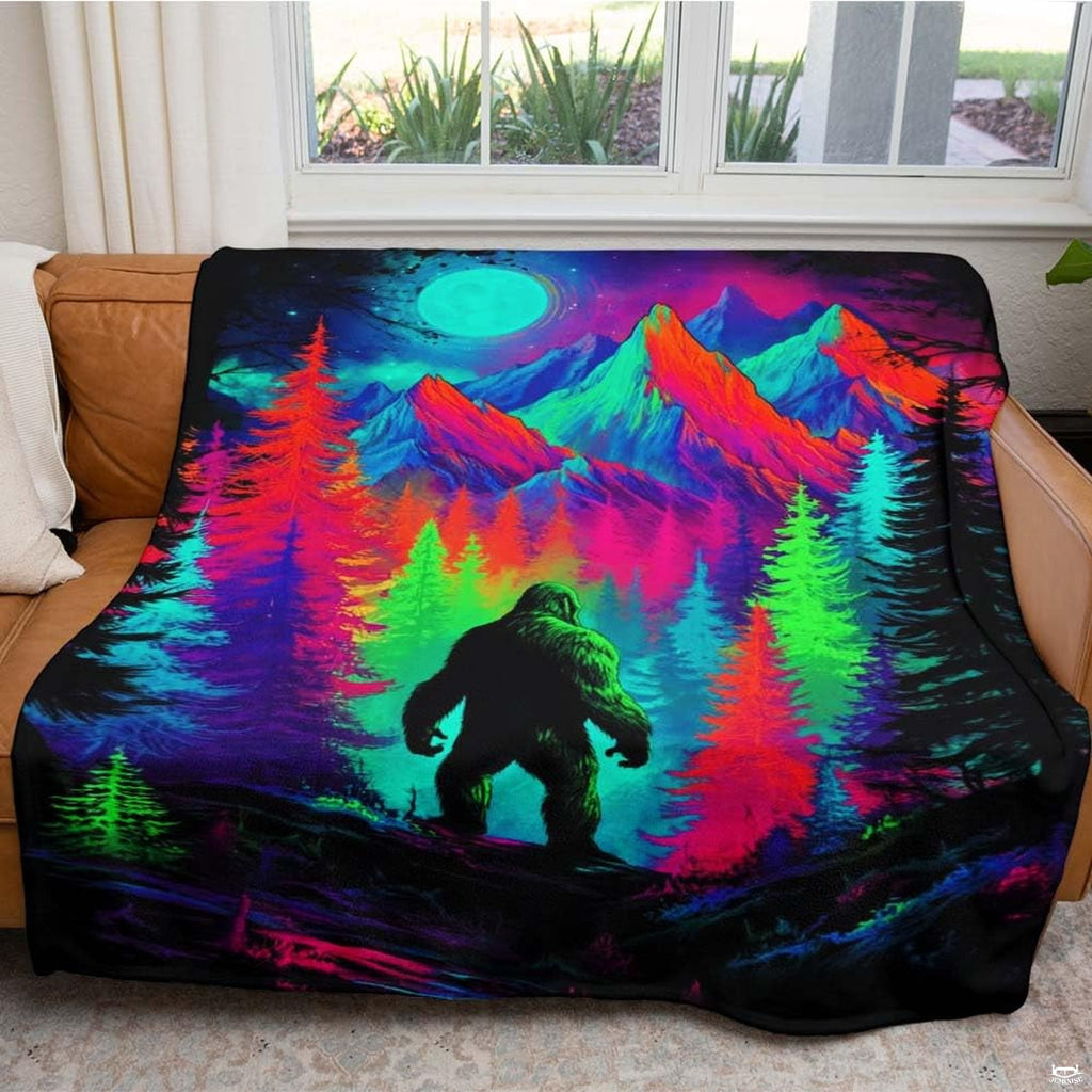 Psychedelic neon Bigfoot Sasquatch standing among glowing mountains and pines, view 5.