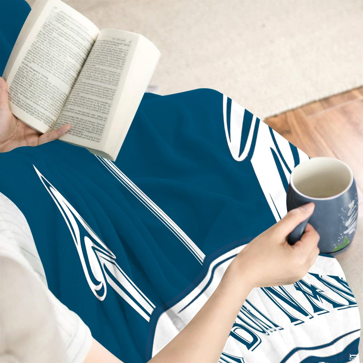 Decorative coastal blue bedroom ideas featuring a central maritime anchor bedding set.