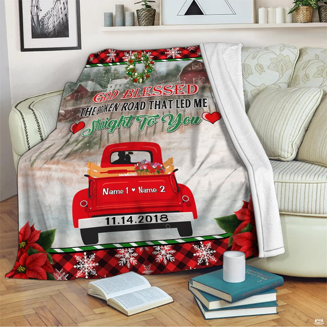 Rustic Christmas red truck decor visual scene featuring snowy countryside barns and evergreen trees.