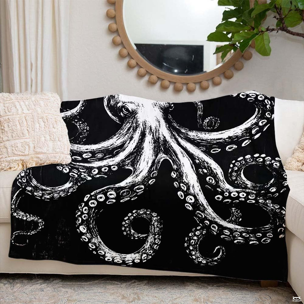 Monochrome octopus design displayed draped across a living room sofa.