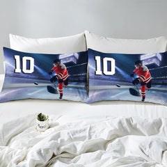 Side angle view of athletic winter sports bedding showing steel blue and slate navy tones on mattress