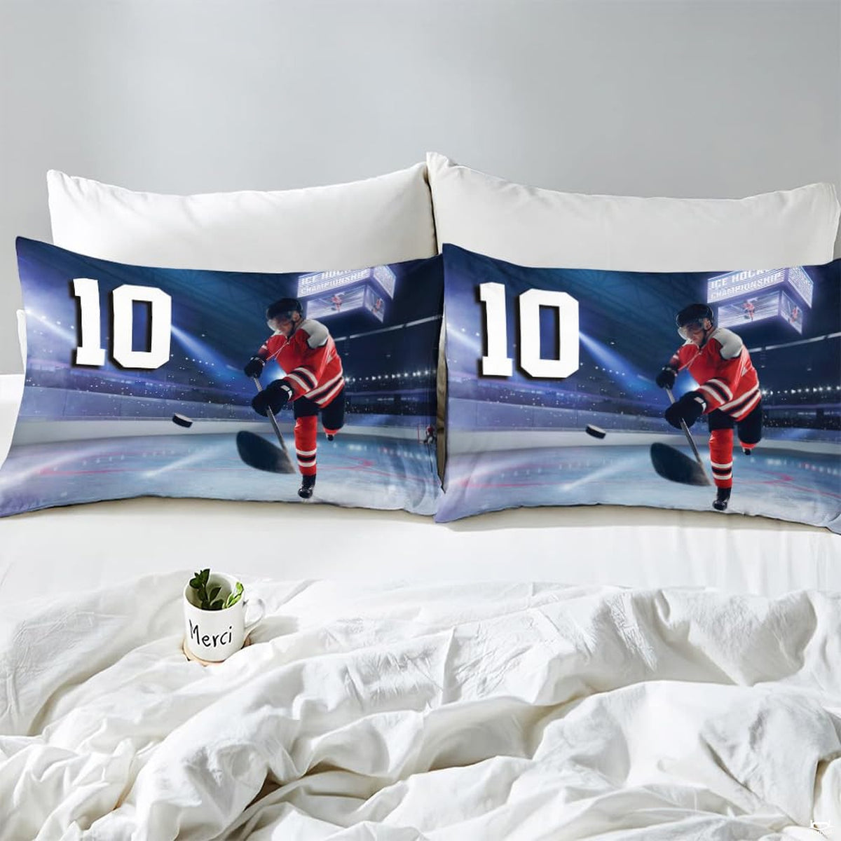 Side angle view of athletic winter sports bedding showing steel blue and slate navy tones on mattress