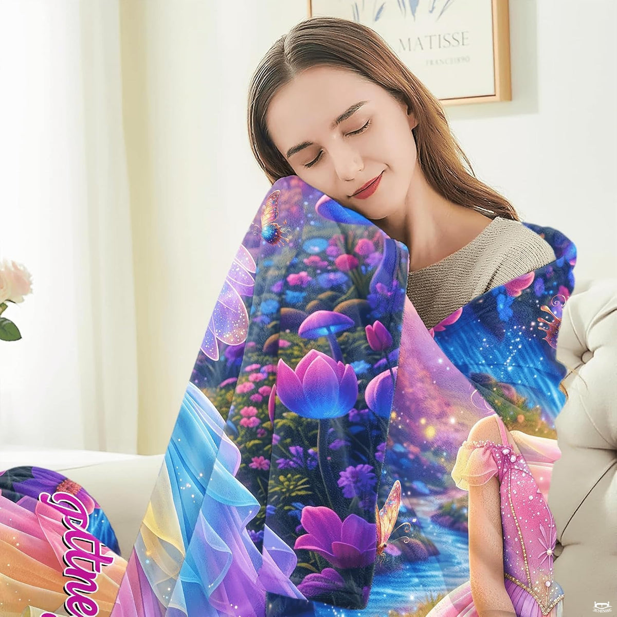 Detail view of neat hemmed edge and vibrant color printing on fairy princess blanket.