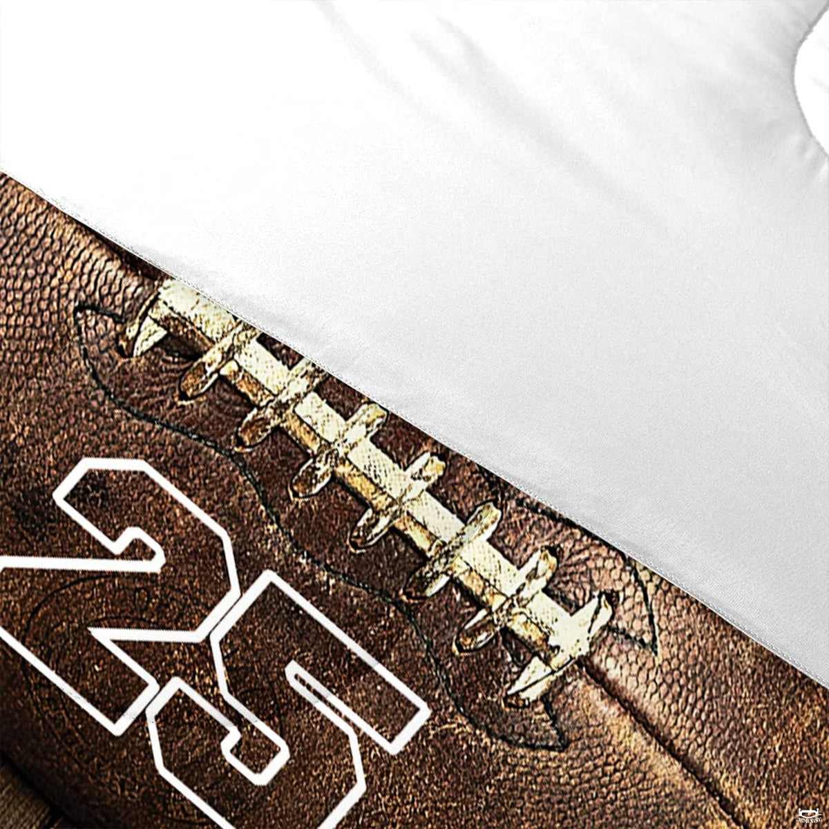 Corner fold view of football bedding highlighting rich sepia and wood grain graphic printing