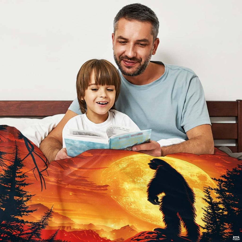 Bigfoot cliff harvest moon throw blanket view 2 styled on living room couch in modern home