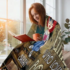 Close-up shot of cursive script manuscript background and antique books on throw blanket.