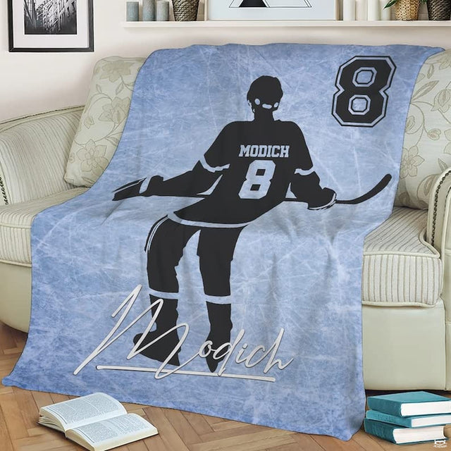 Hockey bedding set display showing ice skater silhouette on frosty rink surface