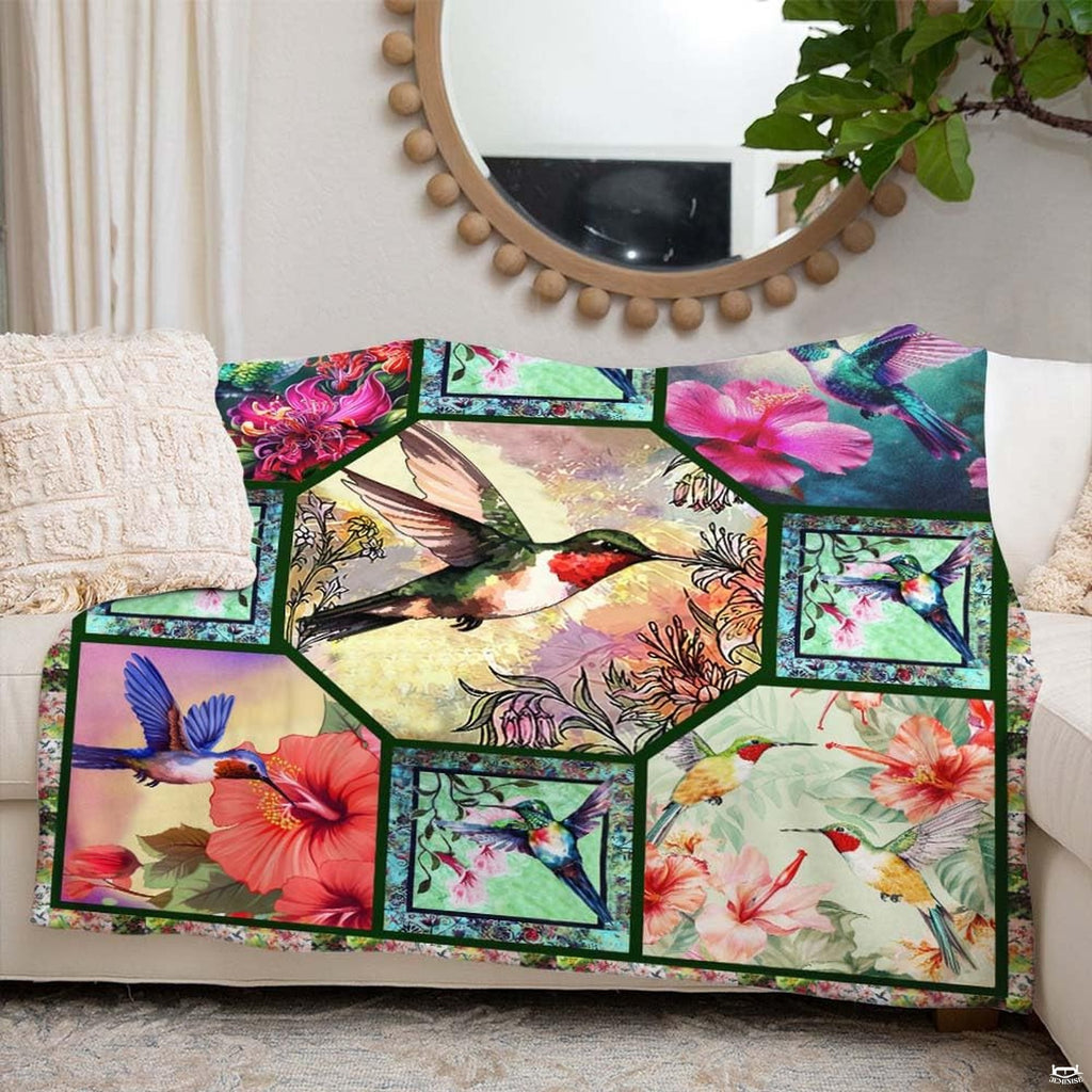 Detailed view of floral botanical vignettes and vibrant plumage motifs across the multi-panel bedding layout.