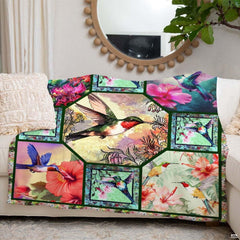 Detailed view of floral botanical vignettes and vibrant plumage motifs across the multi-panel bedding layout.