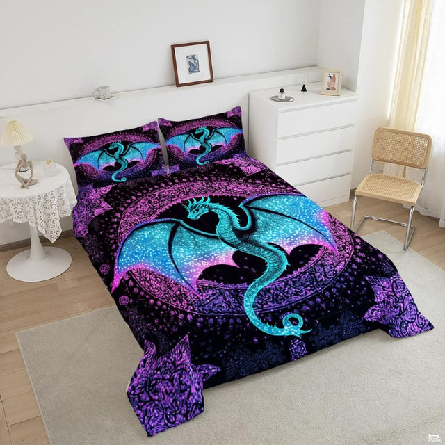 Close-up view of dragon bedding showcasing glittering creature artwork and vibrant orchid magenta tones