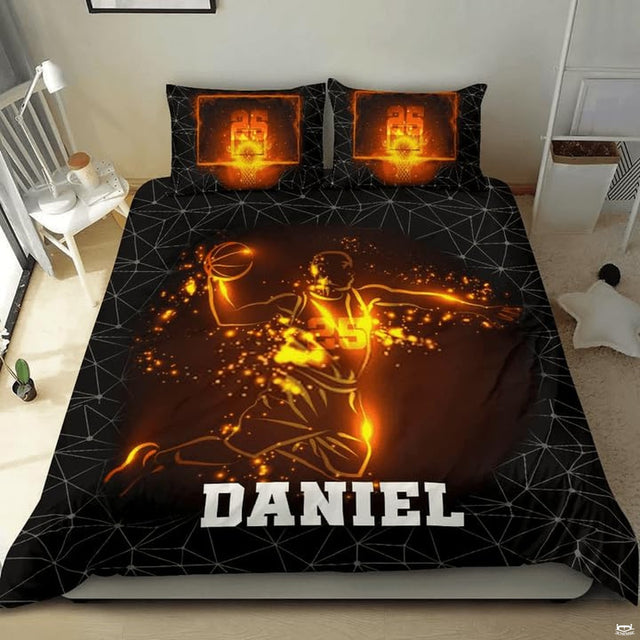 Fiery slam dunk basketball player sports bedding displaying glowing amber athlete and polygon mesh on black bed