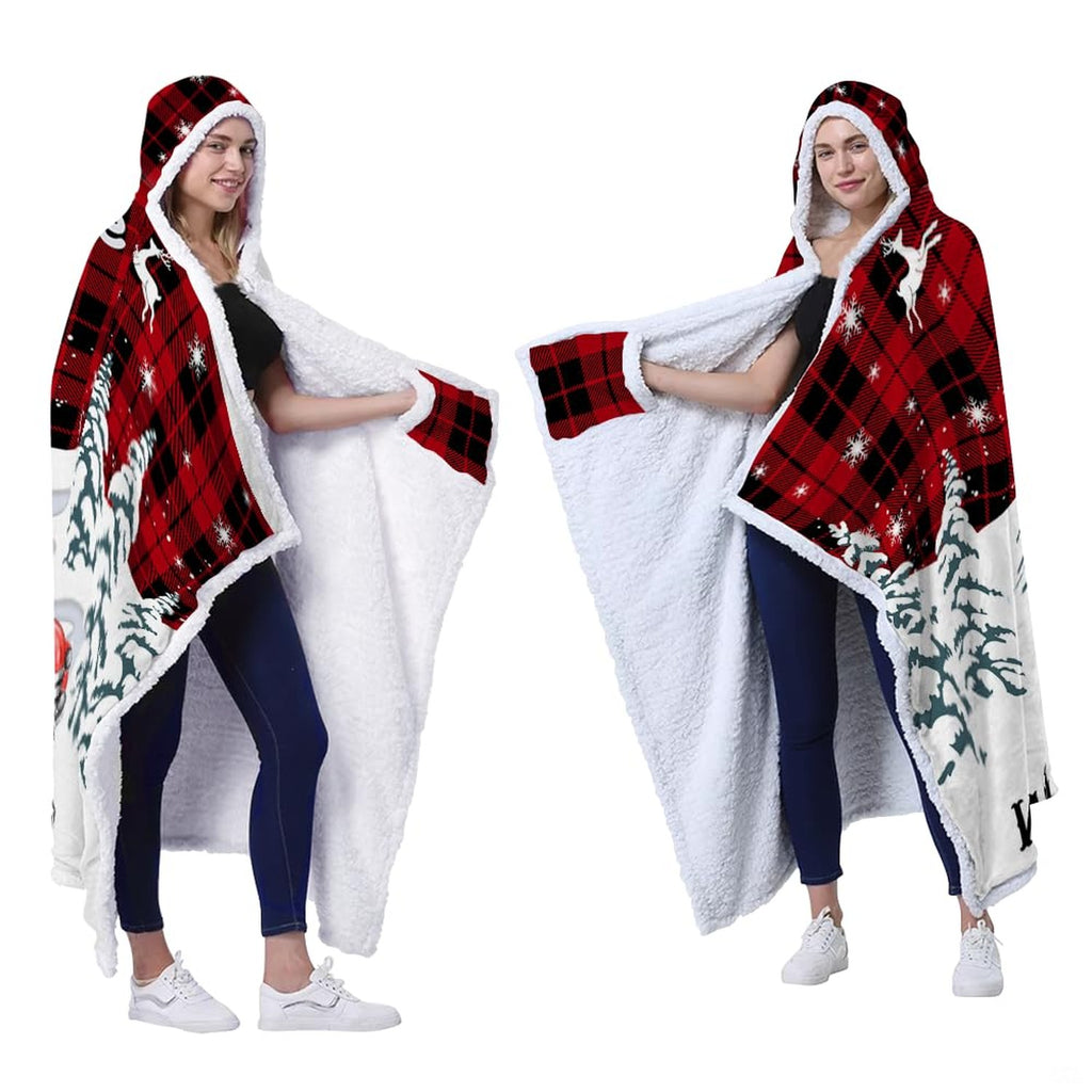 Seasonal buffalo plaid bedding styled in a rustic holiday bedroom with leaping reindeer motifs and snowflakes.