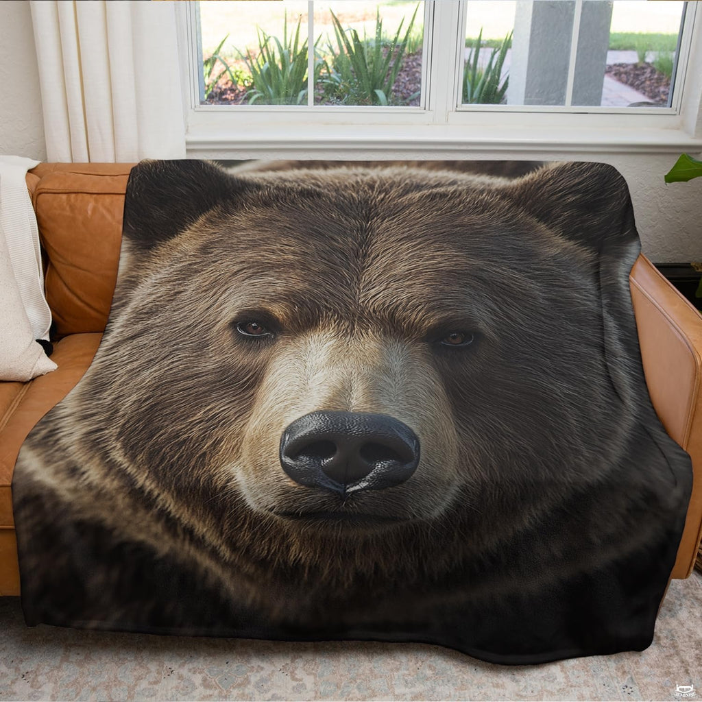 Grizzly bear bedspread motif styled within a modern woodland lodge bedroom setting with rustic wooden decor accents