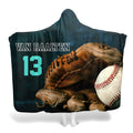 Frontal view of vintage baseball mitt holding a ball beside teal varsity lettering on slate background.