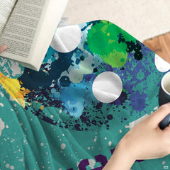 Detailed graphic print highlighting ball holes and dynamic splashes on teal textured decor.
