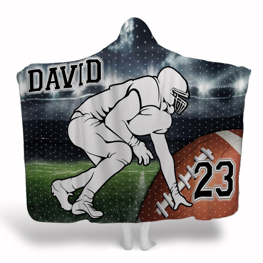 Football lineman stadium throw blanket depicting illustrated player in ready stance on turf under lights