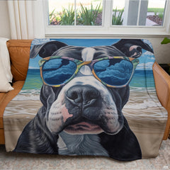 Folded beach sunglasses pitbull throw blanket resting on wooden table displaying coastal colors