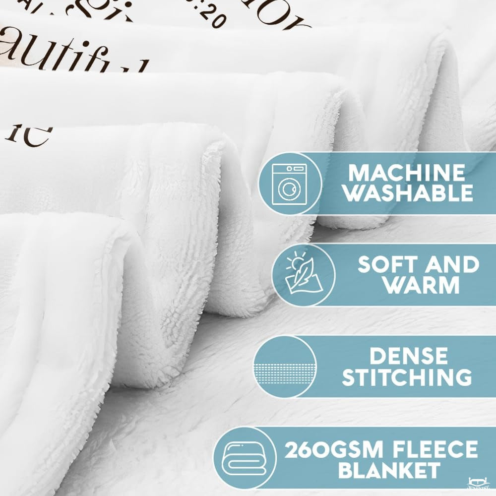 Close-up perspective of blanket fabric edge with dense stitching and product feature badges.