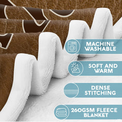Whitetail buck wildlife throw blanket styled across a sofa in a rustic lodge.
