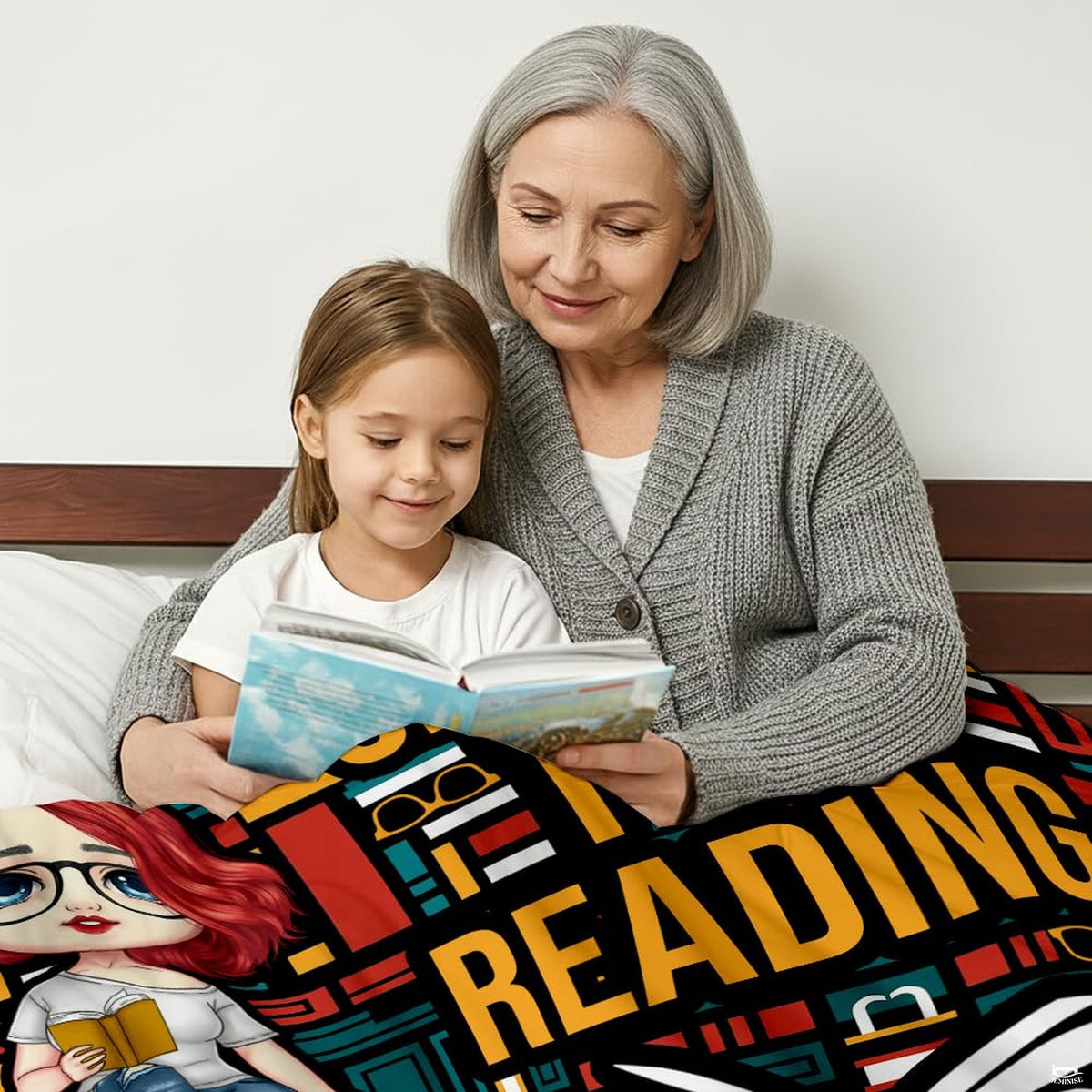 Detail view of colorful book spine patterns and glasses icons on reader throw blanket.
