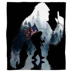 Patriotic Sasquatch throw blanket draped over a contemporary living room sofa