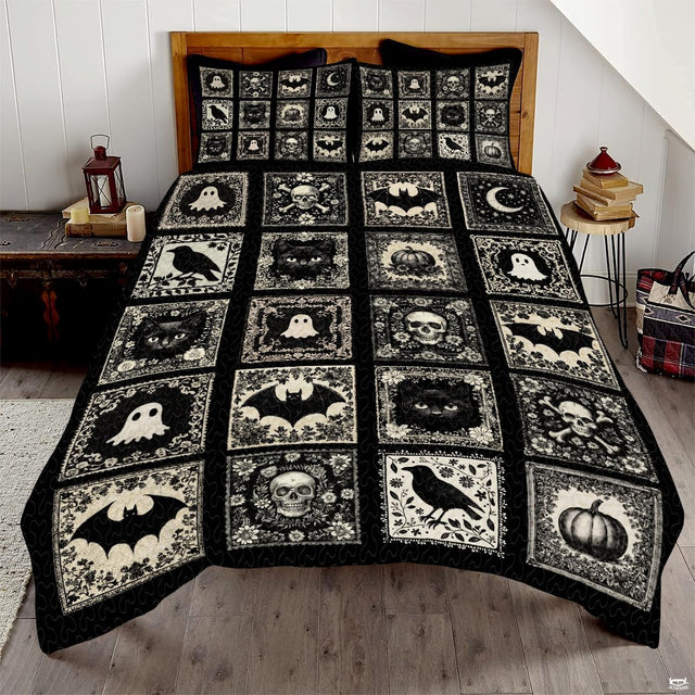 Gothic Halloween bedding featuring an ornate tile patchwork of skulls, bats, ravens, and cats on black backdrop