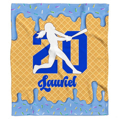 Detail perspective of waffle cone texture and melting frosting glaze on sports throw blanket.