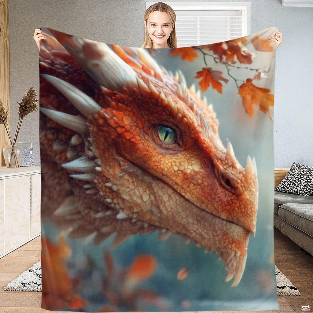 Red fire dragon portrait throw blanket featuring horned dragon head with green eye and autumn leaves