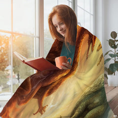 Woman sitting by a sunlit window wrapped in the fantasy dragon textile while enjoying a book.