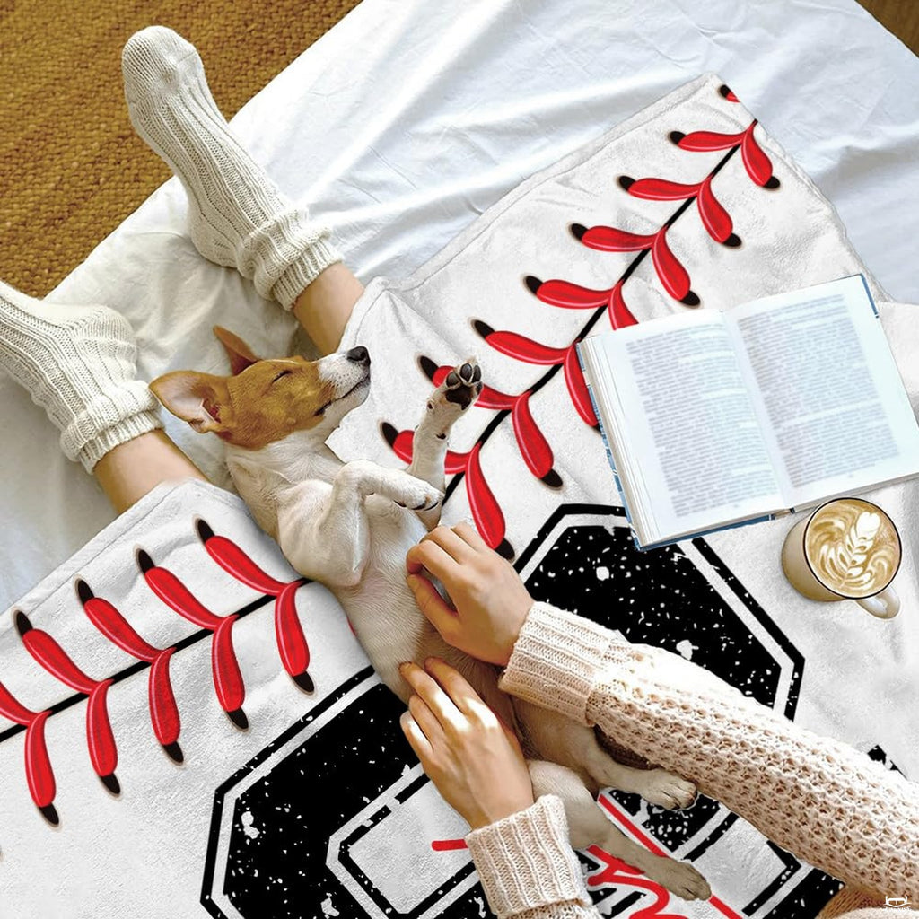 Living room decor setting featuring baseball jersey throw blanket draped over modern sectional sofa
