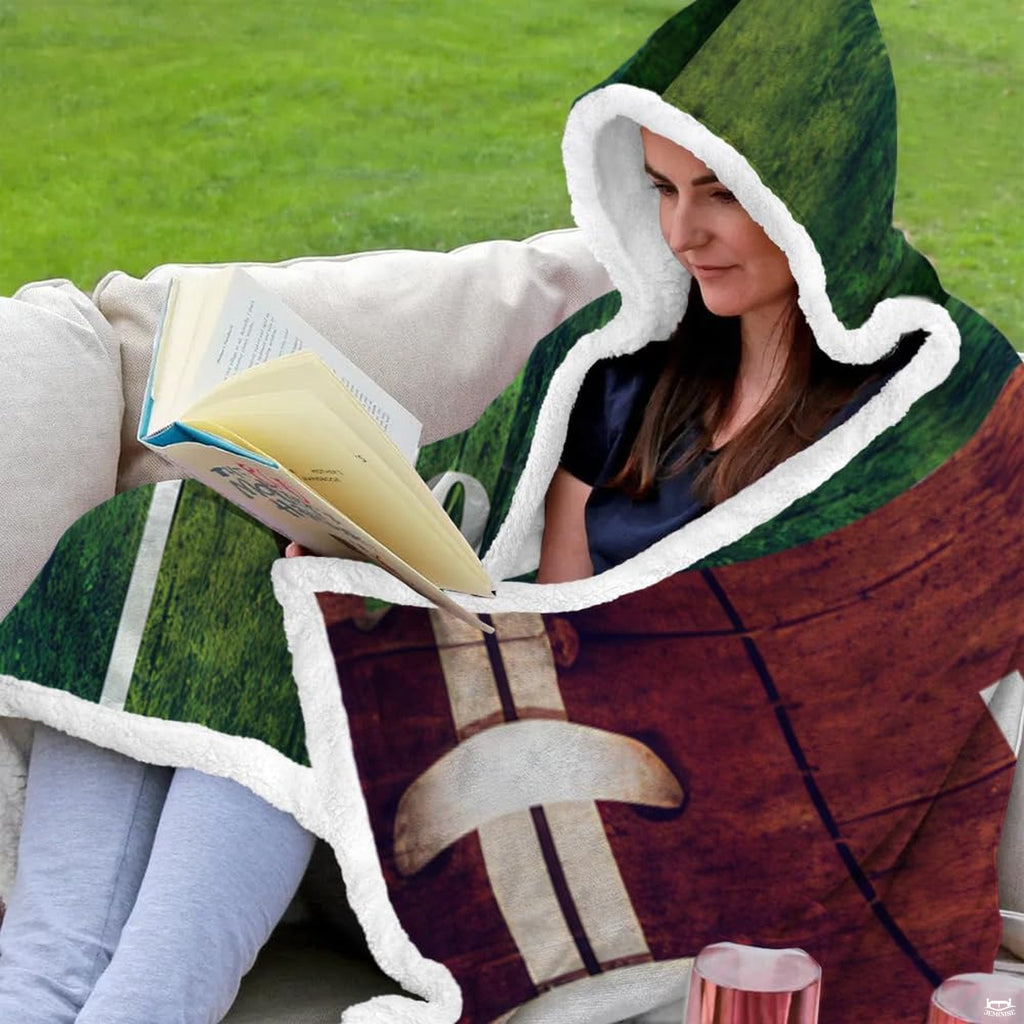 Folded rustic football field throw blanket revealing chestnut timber and emerald green turf graphics